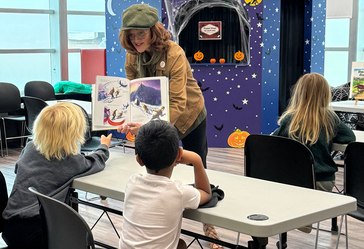 Sheli Petersen reading picture book at school visit